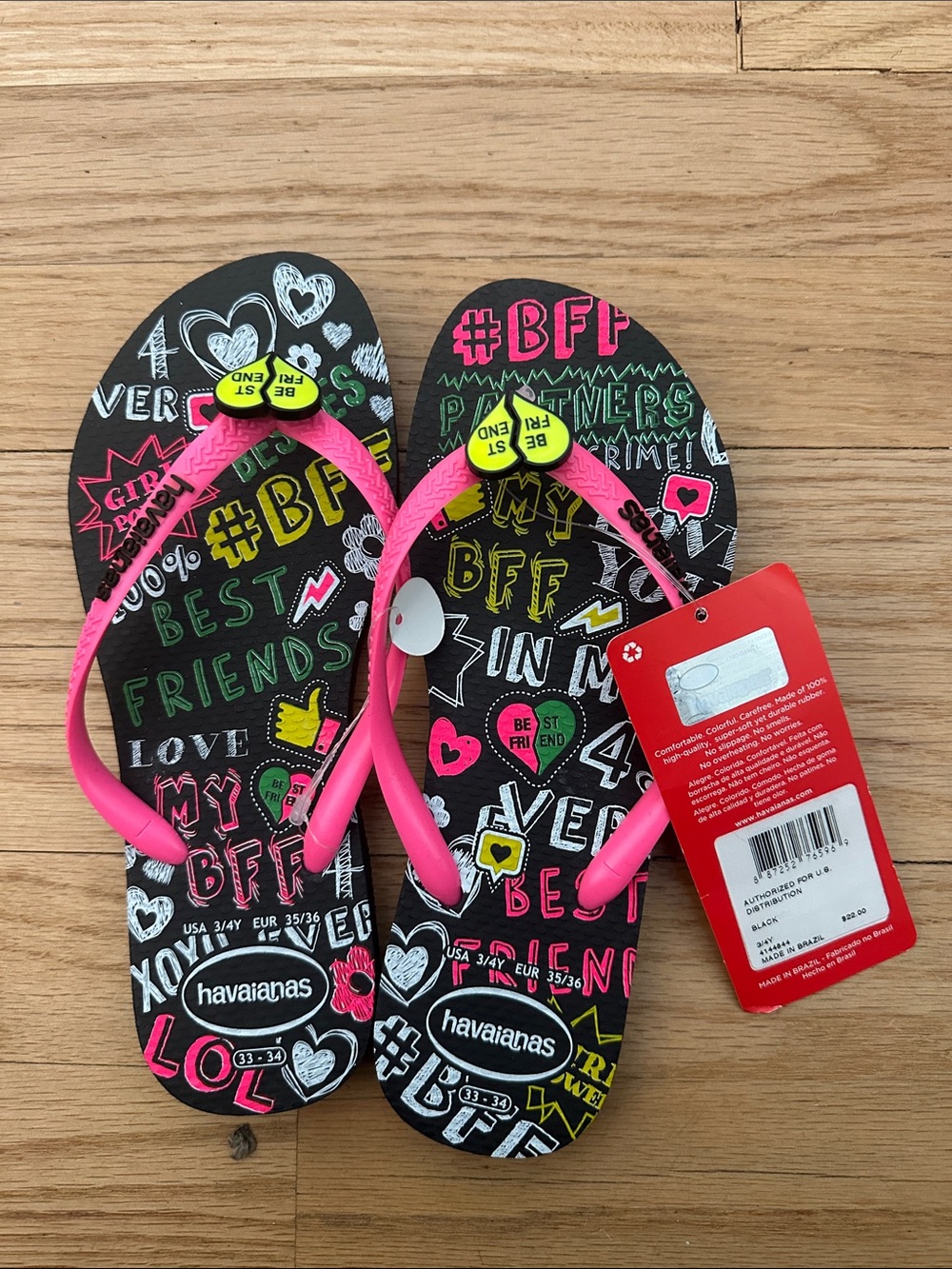Havaianas Kids Black Flip Flops with Neon Pink Straps and Yellow Buttons